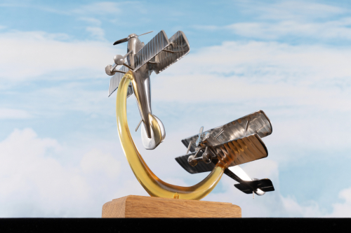 Aluminium sculpture depicting “Bloody April” 1917 aerial combat, showing Sopwith Pup and Albatros D.III biplanes in World War I dogfight.