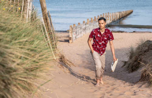 Candid walking shot at Dawlish Warren beach at high tide