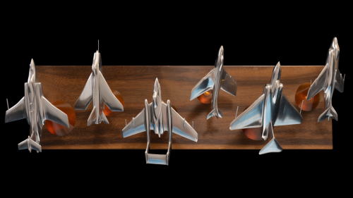 Aluminium sculpture titled “The Cold War” depicting de Havilland Sea Vixen, English Electric Lightning, Supermarine Scimitar, Gloster Javelin, Hawker Hunter, and Blackburn Buccaneer jets from the 1950s–1970s.