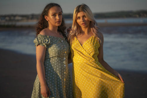 Relaxed summer fashion pose, female model duo at Dawlish Warren – Jason Reading Photography