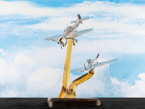 Aluminium sculpture of the Air Battle of Dunkirk 1940, featuring a Junkers Ju 87 “Stuka” dive bomber and Boulton Paul Defiant turret fighter in combat.