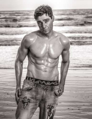 Fitness lifestyle male fashion shot against crashing waves - in monotone – Jason Reading Photography