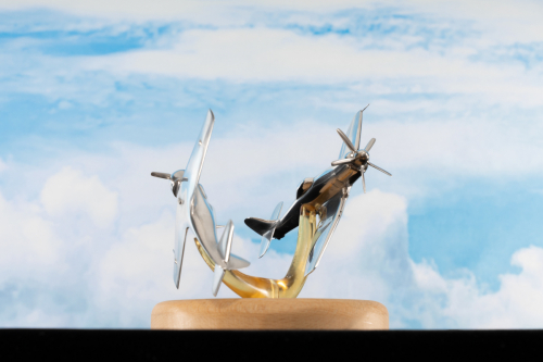 Aluminium sculpture of Korea 1950 air battle, featuring Hawker Sea Fury and Lavochkin La-11 piston fighter aircraft.