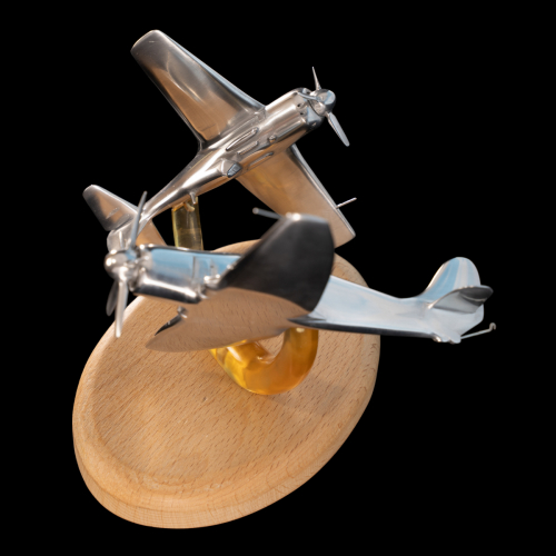 Third view of Korea 1950 aluminium sculpture highlighting Sea Fury and Lavochkin La-11 aircraft models.