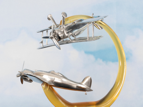 Aluminium sculpture of Malta 1940, featuring Gloster Gladiator fighter biplane engaged in WWII aerial defense.