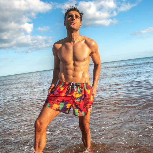 Male model standing in shallow water at Sidmouth
