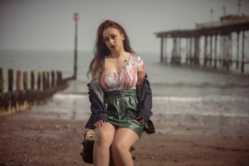 Lifestyle female beach photography with gentle waves background