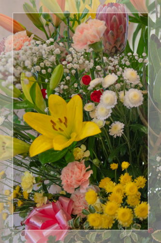 Floral close-up showing wedding flower design with white border at Wambrook Church