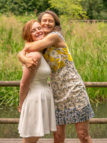 Bride receives a warm hug from her mother at Nine Springs, Yeovil
