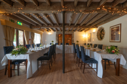 Decorated wedding dining room setup at Hornsbury Mill, Chard